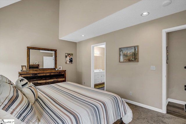 carpeted bedroom featuring recessed lighting, connected bathroom, and baseboards