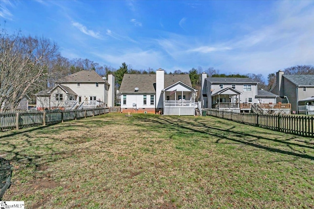 view of yard featuring a residential view and a fenced backyard