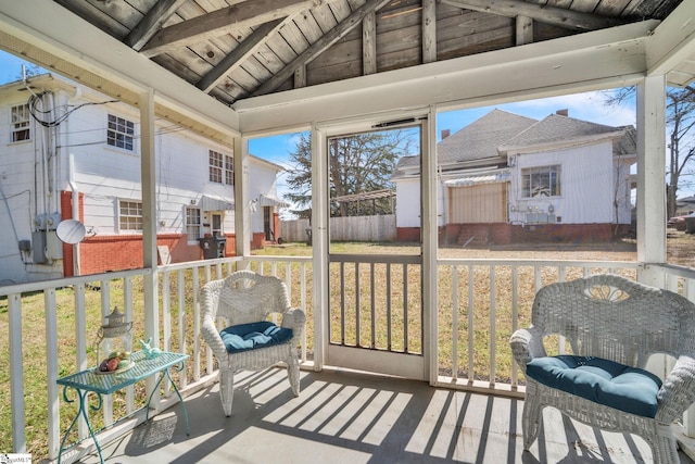 sunroom with vaulted ceiling with beams and wood ceiling