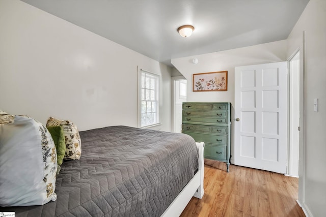 bedroom featuring light wood finished floors