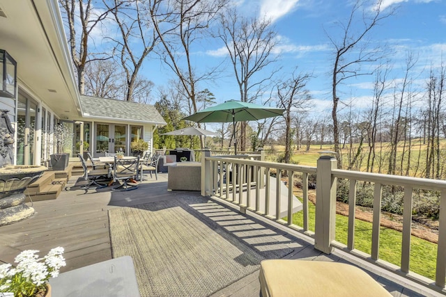 wooden deck with outdoor dining space