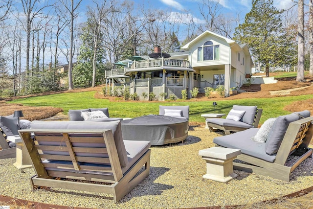 back of house with stairway, an outdoor hangout area, a wooden deck, and a yard