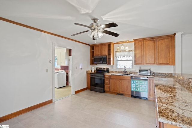 kitchen with washer / dryer, electric range, a sink, dishwasher, and stainless steel microwave