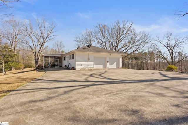 view of home's exterior featuring a sunroom