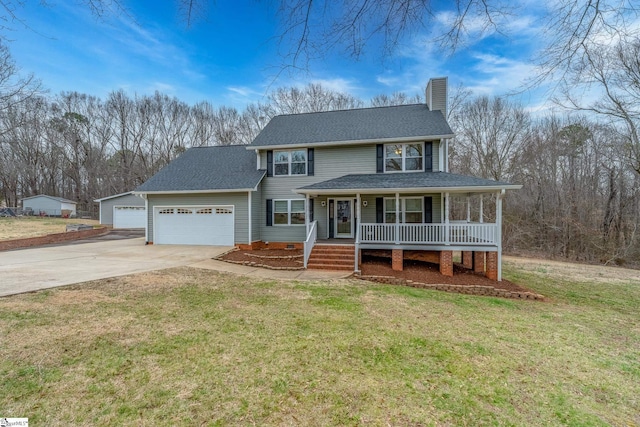 view of front of house with a porch, a chimney, driveway, and a front yard