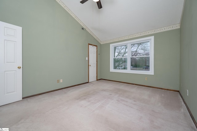 unfurnished room with baseboards, carpet, ceiling fan, and high vaulted ceiling