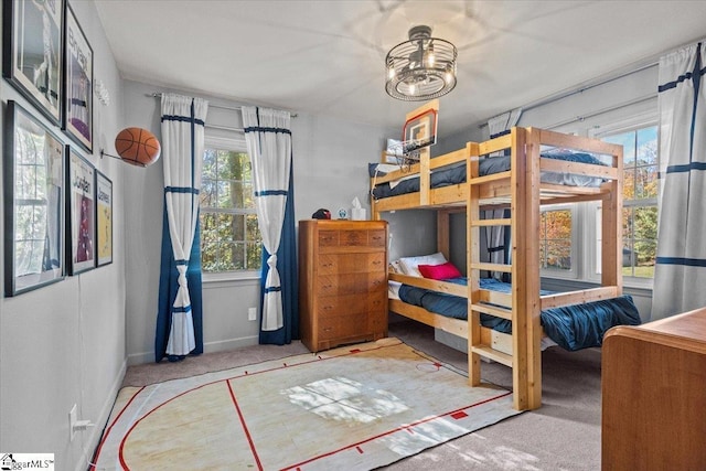 carpeted bedroom with baseboards