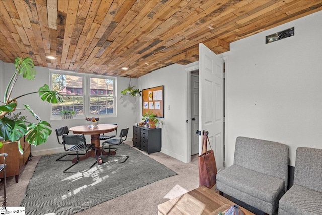 interior space with wooden ceiling, carpet, and baseboards