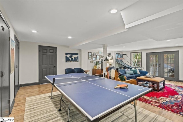 recreation room with light wood finished floors, recessed lighting, french doors, and baseboards