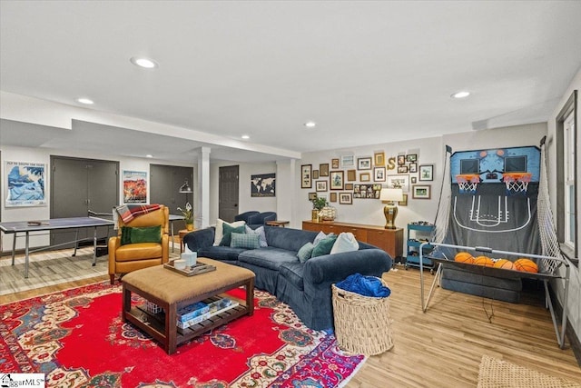 living room with recessed lighting and wood finished floors