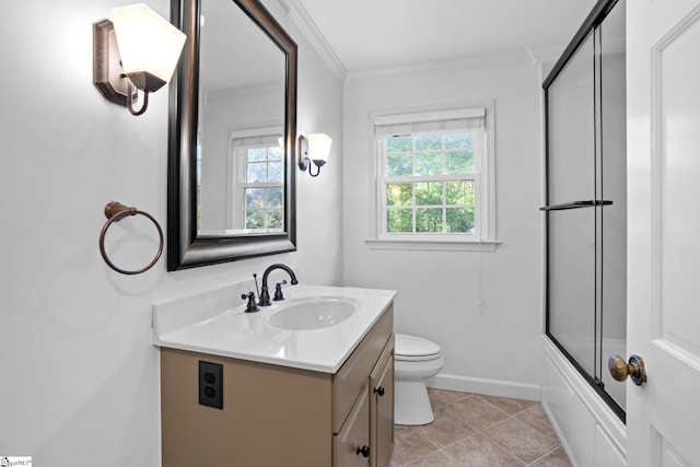 full bath featuring plenty of natural light, toilet, vanity, and crown molding