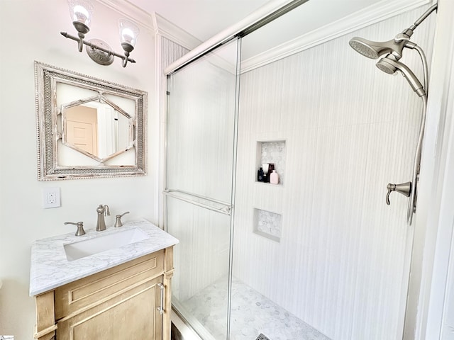 bathroom with vanity, ornamental molding, and a shower stall