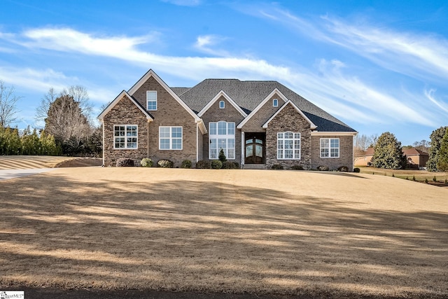 view of front of home featuring brick siding