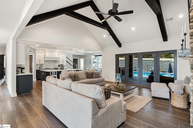 living area with visible vents, high vaulted ceiling, dark wood-type flooring, french doors, and stairs