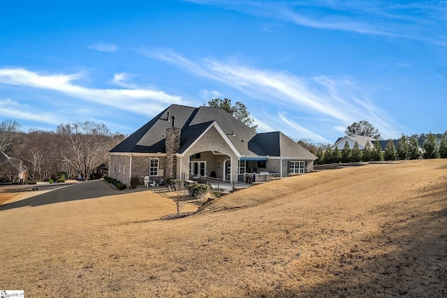 exterior space featuring stone siding