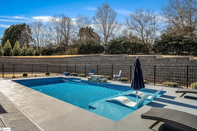 view of pool with a patio area, a fenced in pool, and a fenced backyard