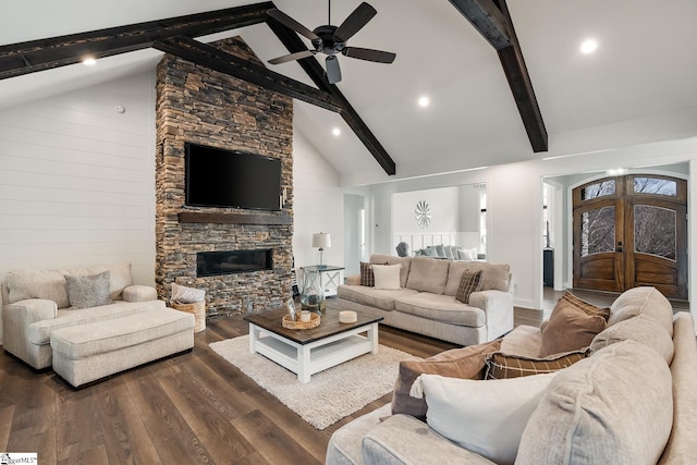 living room with beam ceiling, high vaulted ceiling, wood finished floors, french doors, and a fireplace