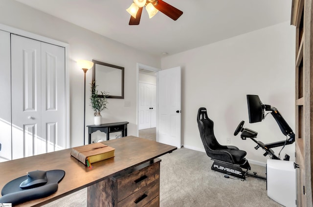 office space featuring baseboards, a ceiling fan, and carpet floors