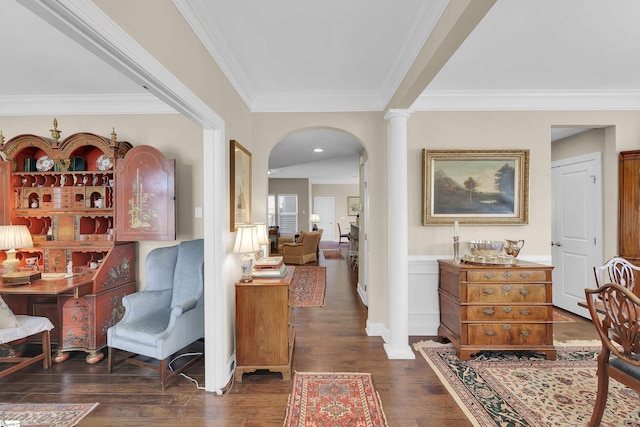 interior space with hardwood / wood-style flooring, decorative columns, arched walkways, and ornamental molding