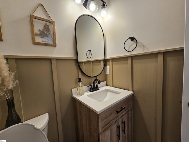 bathroom with toilet and vanity