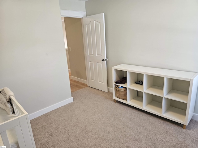 unfurnished bedroom featuring baseboards and carpet floors