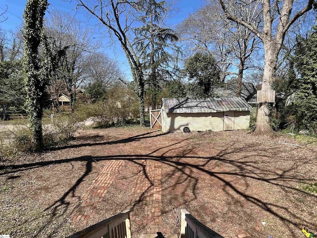 view of yard featuring an outbuilding and a storage unit