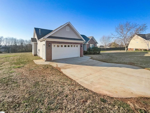 view of property exterior featuring an attached garage, a lawn, brick siding, and driveway