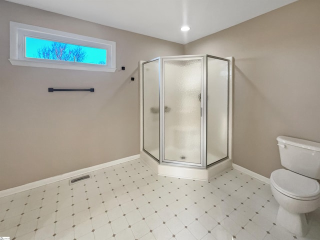 full bath featuring baseboards, visible vents, a shower stall, tile patterned floors, and toilet