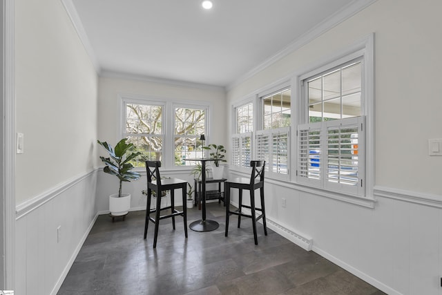 dining room featuring a wainscoted wall and ornamental molding