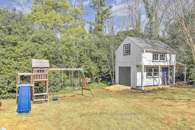 view of playground featuring an outbuilding and a lawn