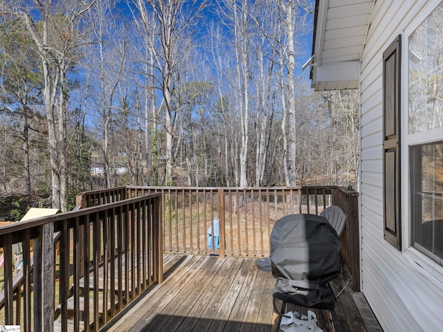 wooden terrace with area for grilling