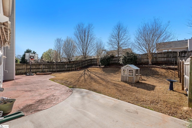 view of yard featuring a patio and a fenced backyard