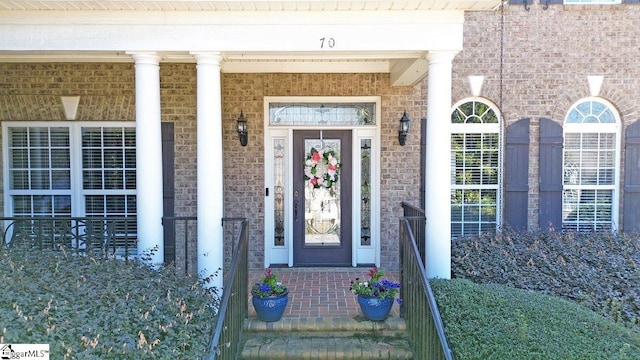 entrance to property with brick siding