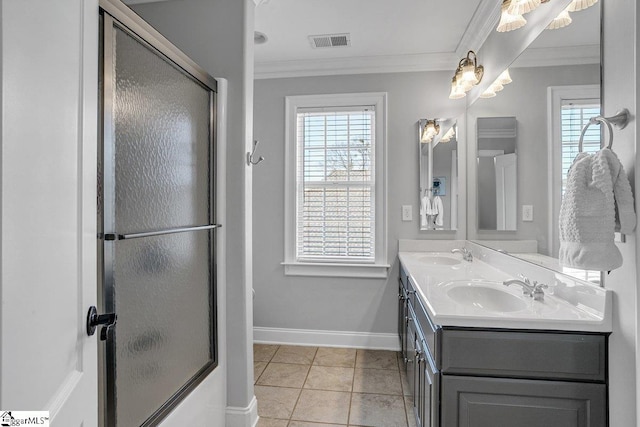 bathroom featuring a sink, visible vents, and crown molding