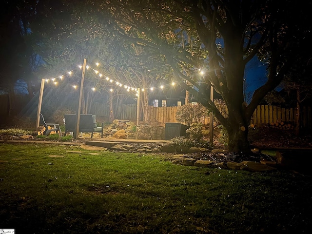 yard at night with fence