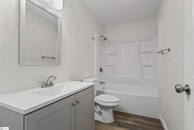 full bath featuring toilet, vanity, shower / bath combination, and wood finished floors