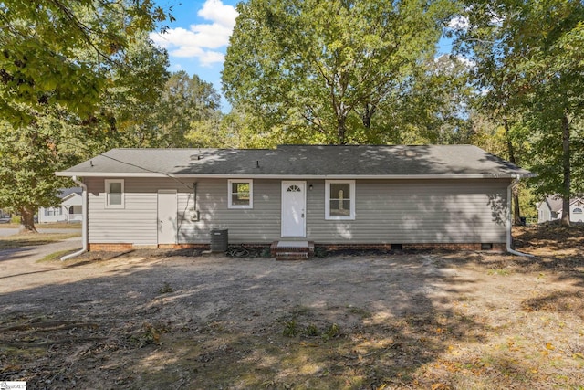 view of front of home featuring entry steps, central air condition unit, and crawl space