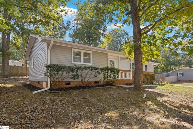 ranch-style home with crawl space and fence