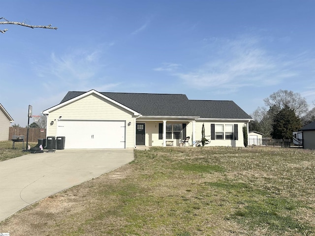 single story home with a front lawn, fence, a porch, a garage, and driveway