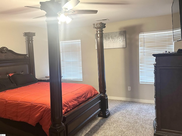 bedroom featuring visible vents, carpet floors, baseboards, and a ceiling fan