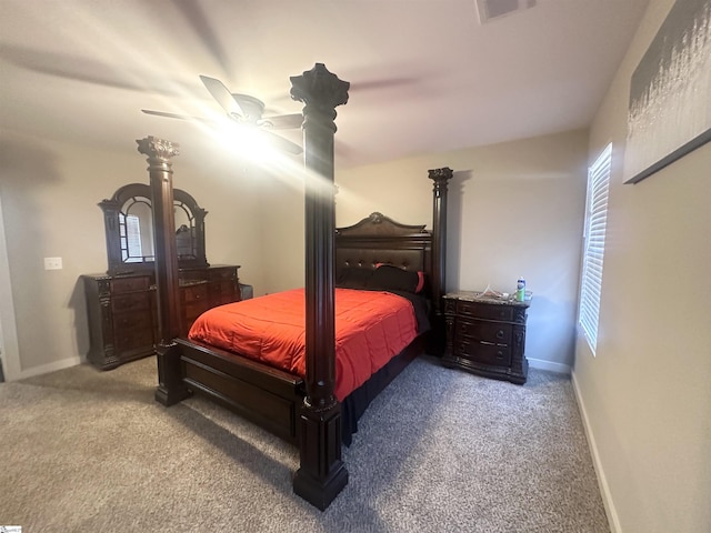 carpeted bedroom featuring visible vents, baseboards, and a ceiling fan