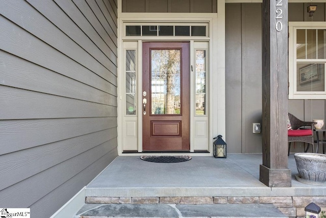 doorway to property with board and batten siding