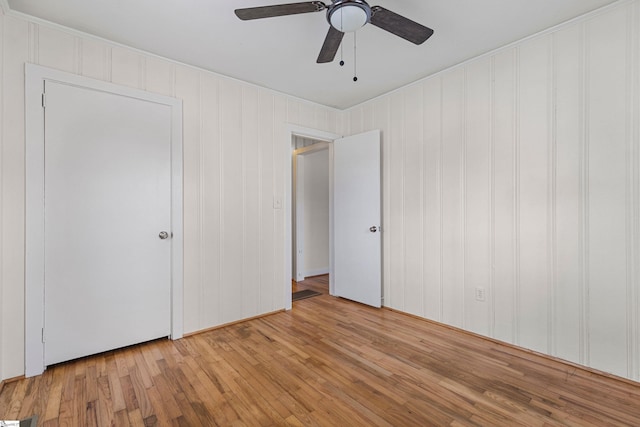 unfurnished bedroom featuring a ceiling fan and light wood finished floors