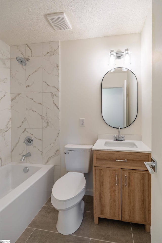 full bathroom with visible vents, toilet, vanity, bathing tub / shower combination, and a textured ceiling