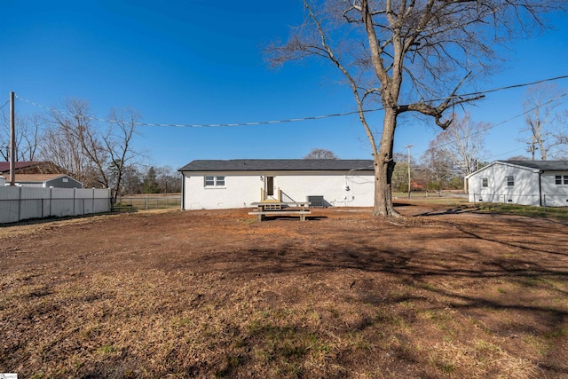 back of property with fence