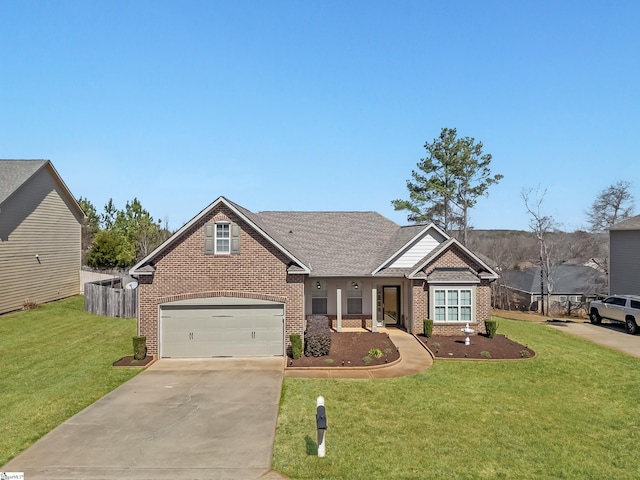 view of front of property featuring brick siding, a garage, concrete driveway, and a front lawn