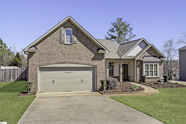 view of front of property with fence, concrete driveway, a front yard, a garage, and brick siding