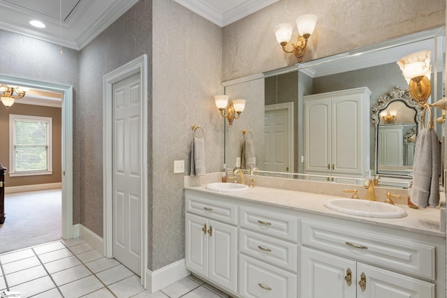 bathroom with a sink, ornamental molding, double vanity, and tile patterned flooring