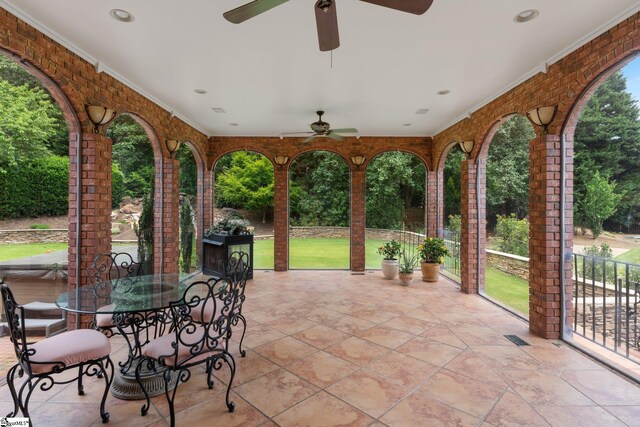 view of patio featuring visible vents, outdoor dining space, and ceiling fan