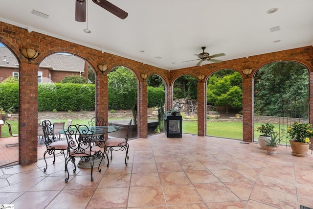 view of patio / terrace featuring visible vents, outdoor dining area, and ceiling fan